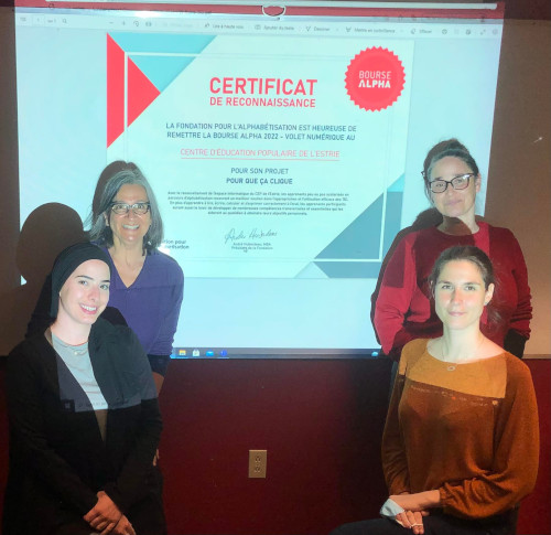 4 femmes devant une présentation de la bourse alpha